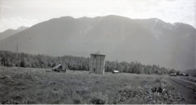Field with structures and machinery. (Images are provided for educational and research purposes only. Other use requires permission, please contact the Museum.) thumbnail