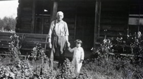 Man and child holding hands. (Images are provided for educational and research purposes only. Other use requires permission, please contact the Museum.) thumbnail