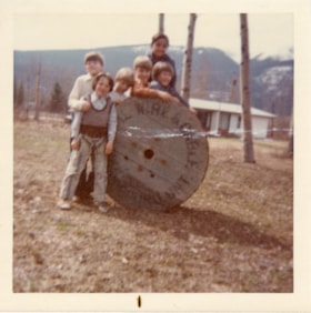 Children playing on a cable spool. (Images are provided for educational and research purposes only. Other use requires permission, please contact the Museum.) thumbnail