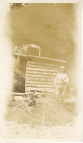 Donald Simpson in front of cabin. (Images are provided for educational and research purposes only. Other use requires permission, please contact the Museum.) thumbnail