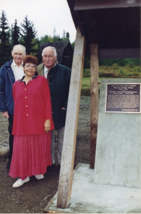 Hugh, Tom, and Carol Atrill with memorial plaque. (Images are provided for educational and research purposes only. Other use requires permission, please contact the Museum.) thumbnail