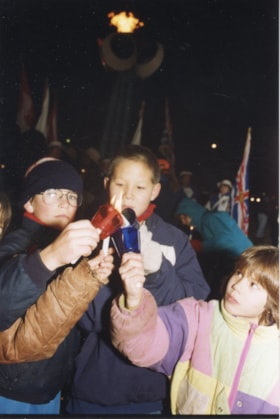 Children with candles at Winter Games torch lighting. (Images are provided for educational and research purposes only. Other use requires permission, please contact the Museum.) thumbnail