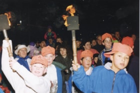 Children carrying torches at Winter Games torch lighting. (Images are provided for educational and research purposes only. Other use requires permission, please contact the Museum.) thumbnail