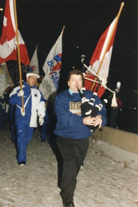 Bagpiper at Winter Games torch lighting. (Images are provided for educational and research purposes only. Other use requires permission, please contact the Museum.) thumbnail