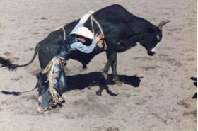 Bull riding at Fall Fair rodeo. (Images are provided for educational and research purposes only. Other use requires permission, please contact the Museum.) thumbnail