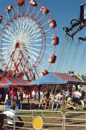 Ferris wheel and swing ride at Fall Fair. (Images are provided for educational and research purposes only. Other use requires permission, please contact the Museum.) thumbnail