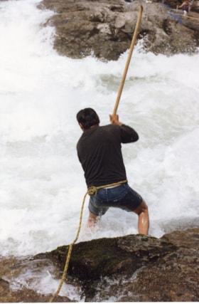 Man gaffing at Widzin Kwah Canyon. (Images are provided for educational and research purposes only. Other use requires permission, please contact the Museum.) thumbnail