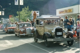 Antique cars in 75th Homecoming parade. (Images are provided for educational and research purposes only. Other use requires permission, please contact the Museum.) thumbnail