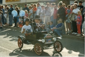 Kids in mini-car in 75th Homecoming parade. (Images are provided for educational and research purposes only. Other use requires permission, please contact the Museum.) thumbnail