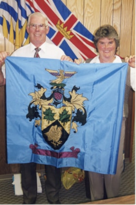 Jim Davidson and Betty Davies holding Smithers flag. (Images are provided for educational and research purposes only. Other use requires permission, please contact the Museum.) thumbnail