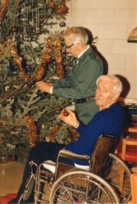 Men decorating Christmas tree at Bulkley Lodge. (Images are provided for educational and research purposes only. Other use requires permission, please contact the Museum.) thumbnail