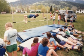 Boy doing high jump at track and field meet. (Images are provided for educational and research purposes only. Other use requires permission, please contact the Museum.) thumbnail