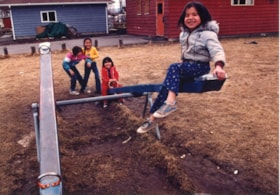 Kids on teeter-totter at Walnut Park School. (Images are provided for educational and research purposes only. Other use requires permission, please contact the Museum.) thumbnail