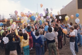 Children releasing balloons at Lake Kathlyn School. (Images are provided for educational and research purposes only. Other use requires permission, please contact the Museum.) thumbnail