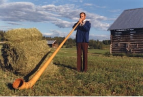 Alphorn being played at Hug farm. (Images are provided for educational and research purposes only. Other use requires permission, please contact the Museum.) thumbnail
