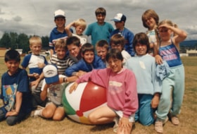 Group of children with beach ball. (Images are provided for educational and research purposes only. Other use requires permission, please contact the Museum.) thumbnail