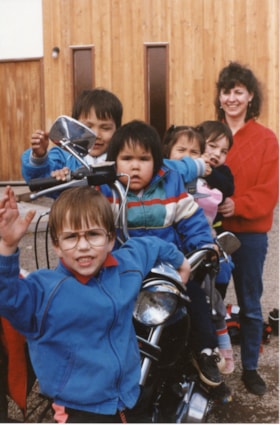 Kids from Child Development Centre with motorcycle. (Images are provided for educational and research purposes only. Other use requires permission, please contact the Museum.) thumbnail