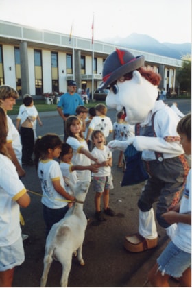 'Alpine Al' giving candy to children at Fall Fair parade. (Images are provided for educational and research purposes only. Other use requires permission, please contact the Museum.) thumbnail