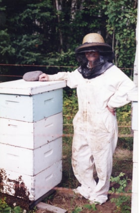 Beekeeper with stacked 'supers'. (Images are provided for educational and research purposes only. Other use requires permission, please contact the Museum.) thumbnail