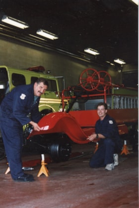 Firefighters with antique fire truck. (Images are provided for educational and research purposes only. Other use requires permission, please contact the Museum.) thumbnail