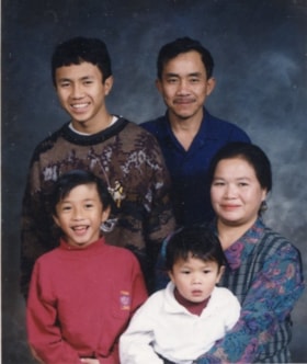 Bounma Sayachack and family. (Images are provided for educational and research purposes only. Other use requires permission, please contact the Museum.) thumbnail