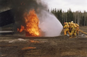 Firefighters in training at Smithers airport. (Images are provided for educational and research purposes only. Other use requires permission, please contact the Museum.) thumbnail