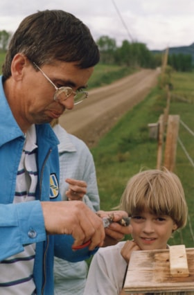John Franken banding blue bird chick. (Images are provided for educational and research purposes only. Other use requires permission, please contact the Museum.) thumbnail
