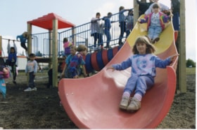 Kids on slide at new Muheim playground. (Images are provided for educational and research purposes only. Other use requires permission, please contact the Museum.) thumbnail