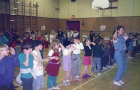 Line dancing at Telkwa Elementary. (Images are provided for educational and research purposes only. Other use requires permission, please contact the Museum.) thumbnail