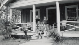 Family on porch of house at Lake Kathlyn. (Images are provided for educational and research purposes only. Other use requires permission, please contact the Museum.) thumbnail
