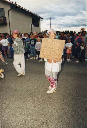 Boy with pro-recycling sign, 1991 Fall Fair parade. (Images are provided for educational and research purposes only. Other use requires permission, please contact the Museum.) thumbnail