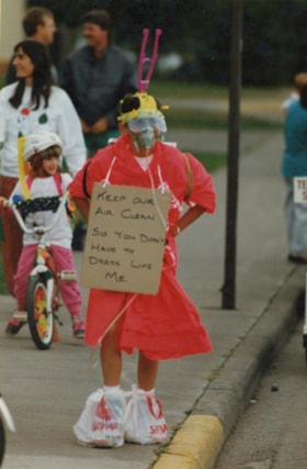 Boy with clean air sign, 1991 Fall Fair parade. (Images are provided for educational and research purposes only. Other use requires permission, please contact the Museum.) thumbnail