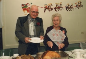 Cornelius and Alida Bot at Elks Christmas dinner. (Images are provided for educational and research purposes only. Other use requires permission, please contact the Museum.) thumbnail