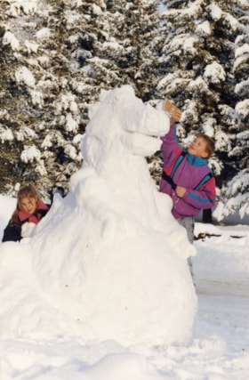 Children with dinosaur snow sculpture. (Images are provided for educational and research purposes only. Other use requires permission, please contact the Museum.) thumbnail