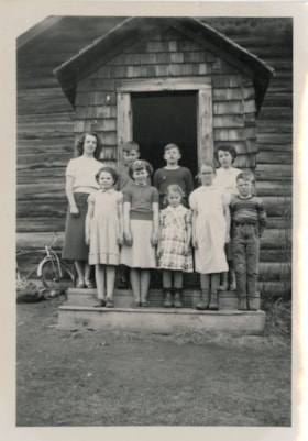 Kispiox School students and teacher in doorway. (Images are provided for educational and research purposes only. Other use requires permission, please contact the Museum.) thumbnail