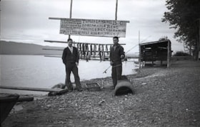 Men near Paddy Leon's boat rental sign at Topley Landing. (Images are provided for educational and research purposes only. Other use requires permission, please contact the Museum.) thumbnail