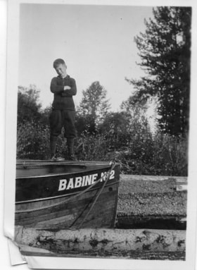 Boy standing on Babine Lake boat. (Images are provided for educational and research purposes only. Other use requires permission, please contact the Museum.) thumbnail