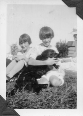 K and Jo with a dog. (Images are provided for educational and research purposes only. Other use requires permission, please contact the Museum.) thumbnail