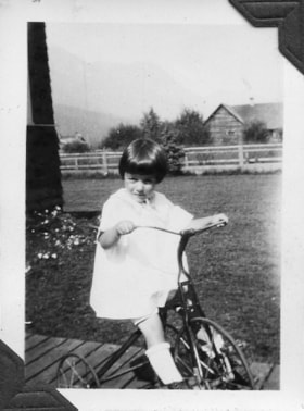 Gertrude on a tricycle. (Images are provided for educational and research purposes only. Other use requires permission, please contact the Museum.) thumbnail
