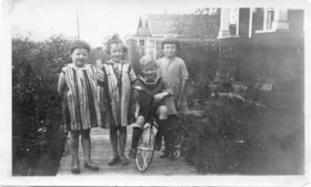 Four Children on a Boardwalk. (Images are provided for educational and research purposes only. Other use requires permission, please contact the Museum.) thumbnail