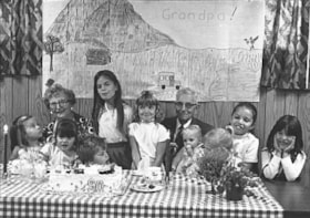 Ed Lund with (great?-)grandchildren at 90th birthday party. (Images are provided for educational and research purposes only. Other use requires permission, please contact the Museum.) thumbnail