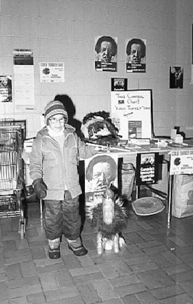 Child with puppet at 'Cold Turkey Day' booth. (Images are provided for educational and research purposes only. Other use requires permission, please contact the Museum.) thumbnail