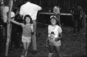 Two kids at Anglican Church picnic. (Images are provided for educational and research purposes only. Other use requires permission, please contact the Museum.) thumbnail