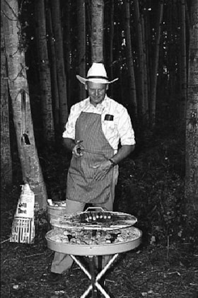 Grilling hot dogs at Anglican Church picnic. (Images are provided for educational and research purposes only. Other use requires permission, please contact the Museum.) thumbnail