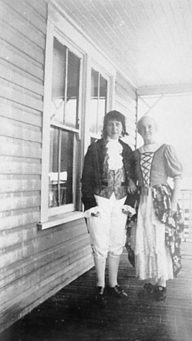Unidentified pair in Halloween costumes. (Images are provided for educational and research purposes only. Other use requires permission, please contact the Museum.) thumbnail