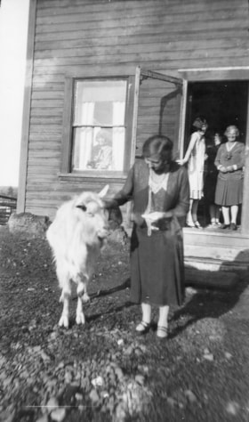 Jessie McInnes in front of Mission House. (Images are provided for educational and research purposes only. Other use requires permission, please contact the Museum.) thumbnail