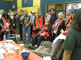 Chiefs and dignitaries gather around Chief Ut'akhgit Henry Alfred at Shared Histories feast. (Images are provided for educational and research purposes only. Other use requires permission, please contact the Museum.) thumbnail