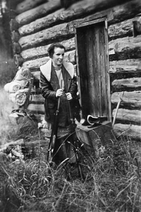 Betty Dungate at Heading's old cabin. (Images are provided for educational and research purposes only. Other use requires permission, please contact the Museum.) thumbnail