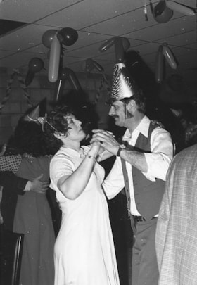 Couple dancing at Houston New Year's party. (Images are provided for educational and research purposes only. Other use requires permission, please contact the Museum.) thumbnail