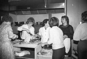 Houston Boosters preparing Christmas dinner for senior citizens. (Images are provided for educational and research purposes only. Other use requires permission, please contact the Museum.) thumbnail